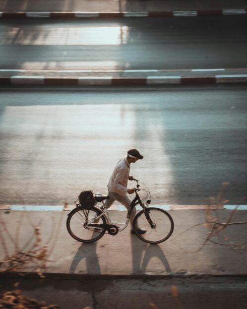 Active Transport | Man walking bike on path